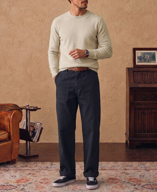 Apricot merino wool crewneck sweater with long sleeves and ribbed cuffs