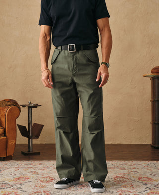 Olive field cargo trousers on model with front pockets and belt