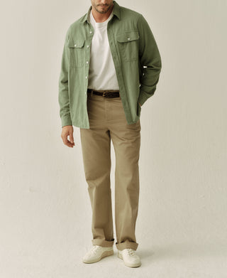 Man wearing sage brushed cotton flannel work shirt with button-front and pockets