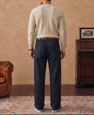 Apricot merino wool crewneck sweater worn, view from back.