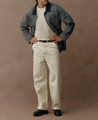Gray-blue canvas jacket shown full length with dark collar and roomy fit