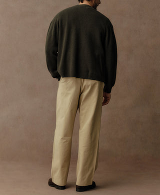 Olive knit cardigan back view with full sleeves and ribbed hem