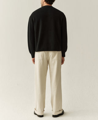 Back view of black knit cardigan with full-length sleeves